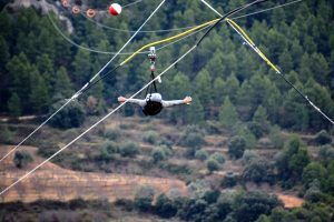 User flying on the longest zip line in Europe in Aragón Spain
