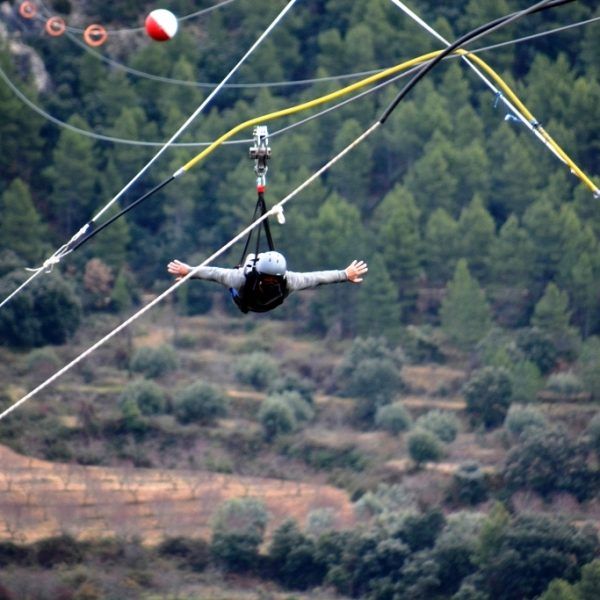 User flying on the longest zip line in Europe in Aragón Spain