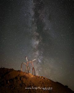 Vintage bicycle under dark sky in Monroyo Spain photo by Luis Pitarque